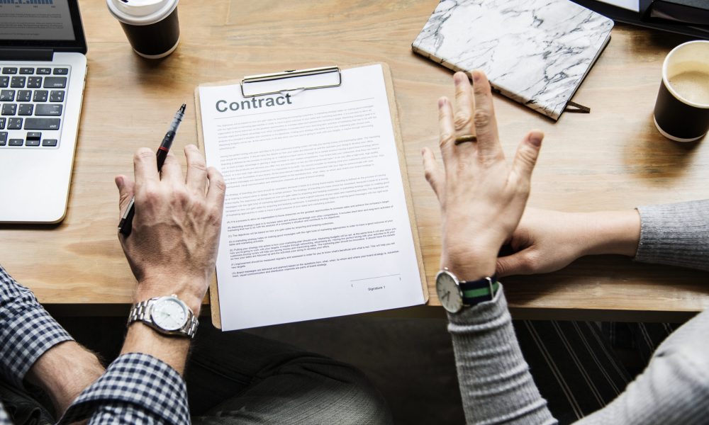 Business people discussing a contract Business people discussing a contract